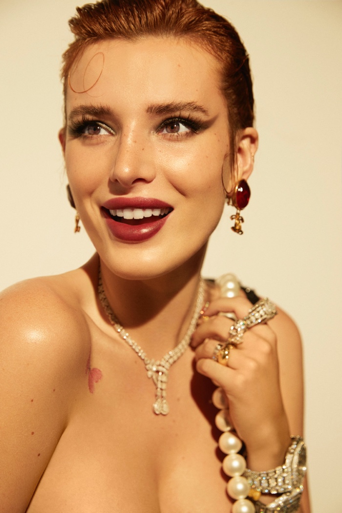 All smiles, Bella Thorne wears a Chanel look.