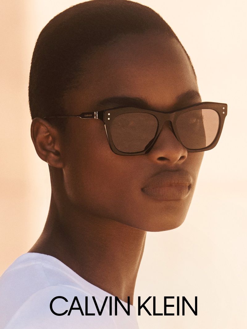 Mayowa Nicholas wears chic sunglasses in Calvin Klein fall-winter 2020 campaign.