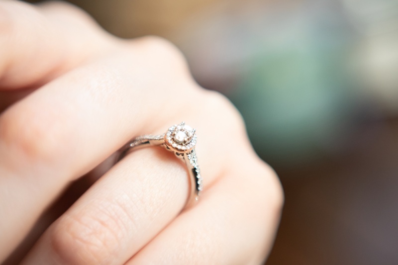 Closeup Oval Engagement Halo Diamond Ring Hand