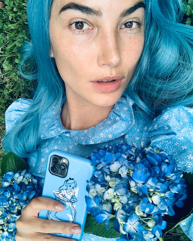 Lily Aldridge channels Alice in Wonderland for CHAOS x Disney Classics.