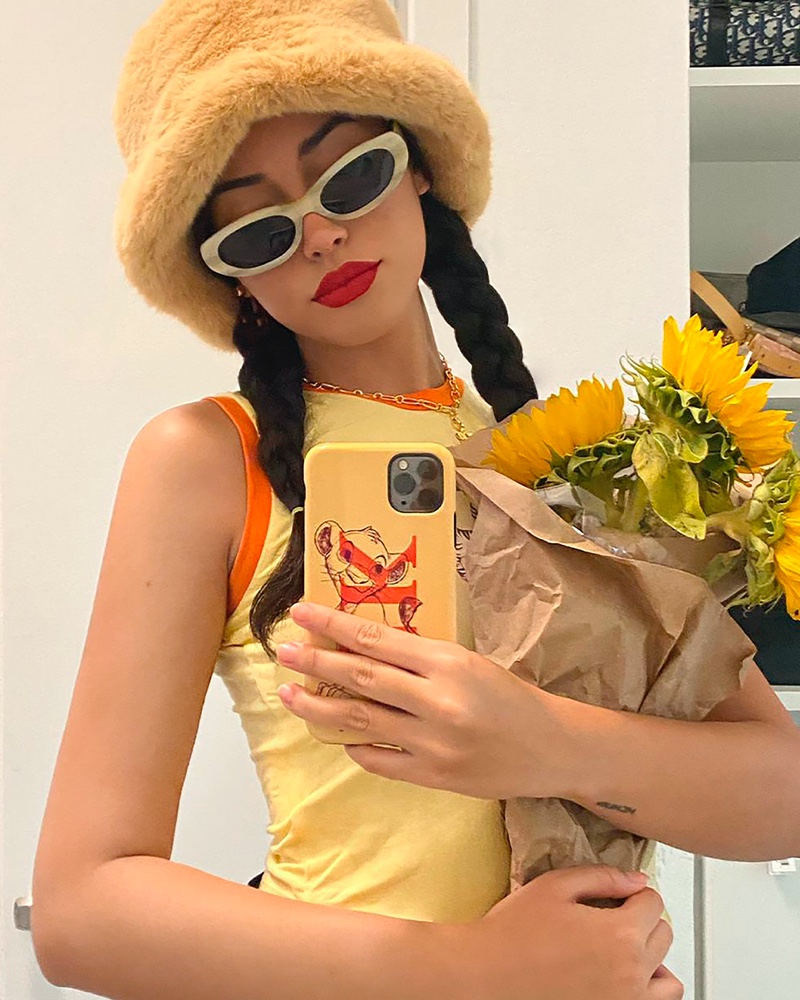 Christina Nadin poses with Simba CHAOS x Disney Classics iPhone case.