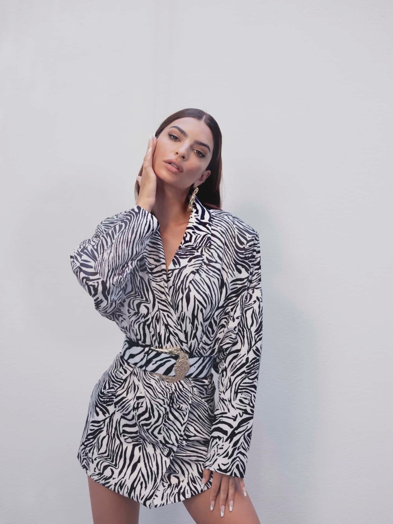 Emily Ratajkowski models Nasty Gal x EMRATA zebra print blazer dress.