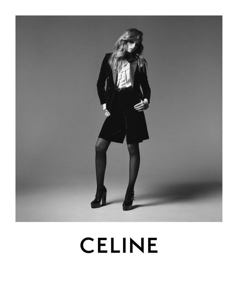 Fran Summers models black velvet tuxedo jacket and Bermuda shorts from Celine winter 2020 collection.