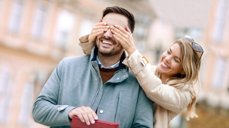 Girlfriend Covering Man's Eyes Gift Smiling Couple Happy