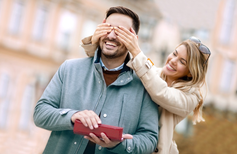 Girlfriend Covering Man's Eyes Gift Smiling Couple Happy