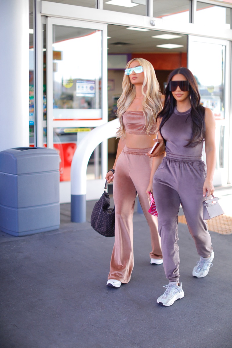 Going for a candid stroll, Kim Kardashian and Paris Hilton wear SKIMS velour collection.