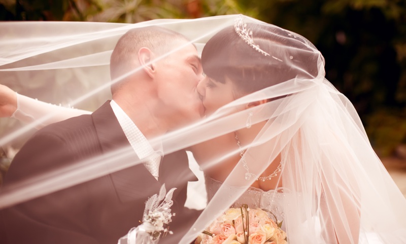 Kissing Bride Groom Under Veil Romantic
