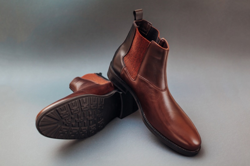 Men's Brown Leather Boots on Grey Background