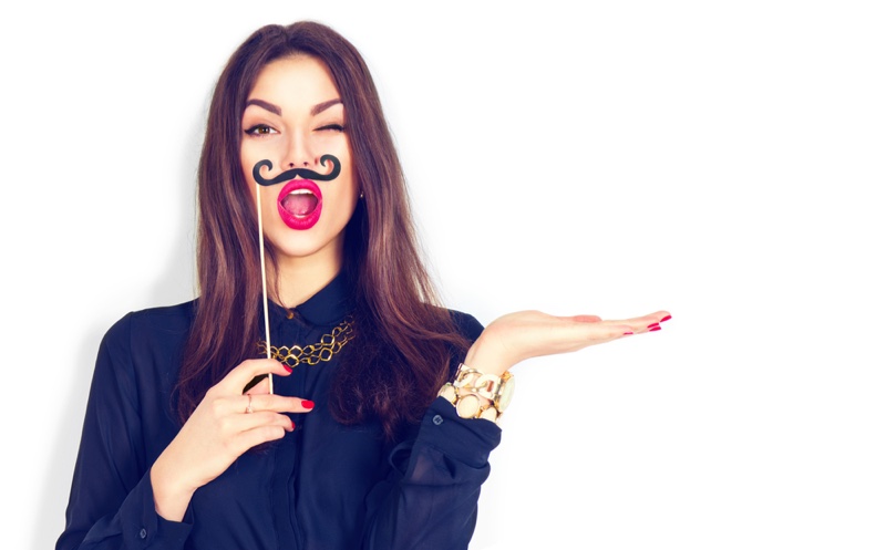 Model Holding Mustache Fun Whimsical Fashion