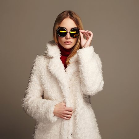 Must-Have Accessories to Buy This Winter Model White Faux Fur Coat Sunglasses