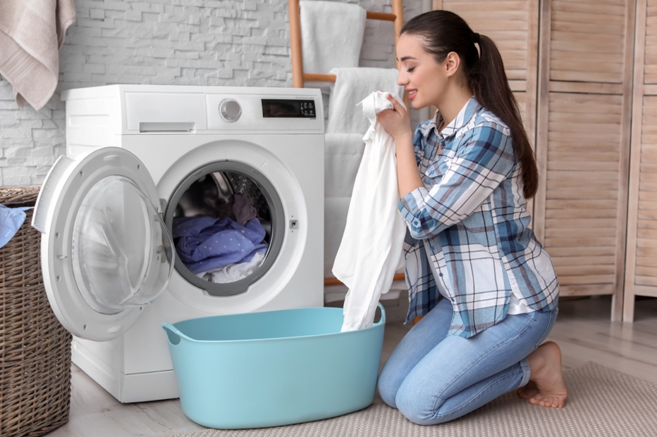 Smiling Woman Doing Laundry Washing Machine