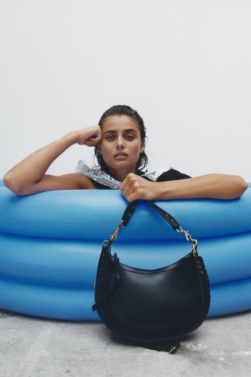 Taylor Hill poses with Isabel Marant Naoko bag.