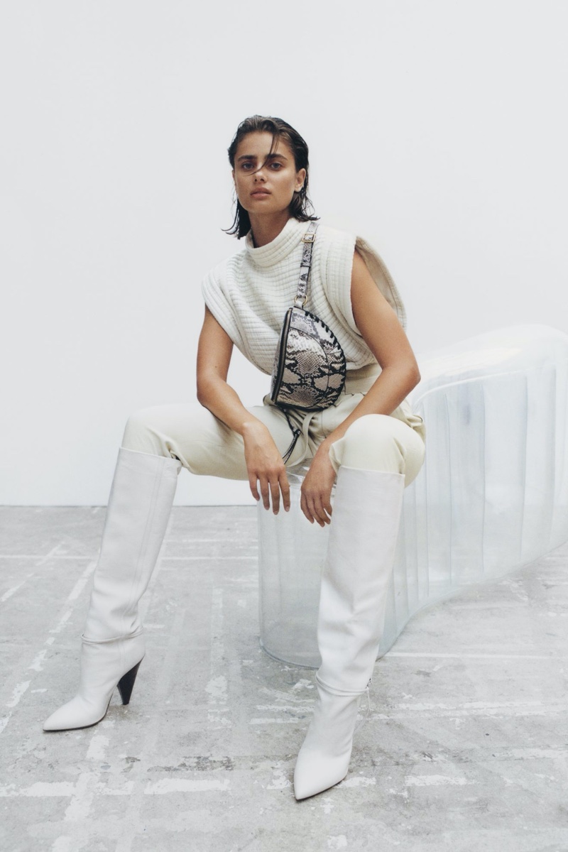 Dressed in white, Taylor Hill fronts Isabel Marant fall-winter 2020 accessories collection.