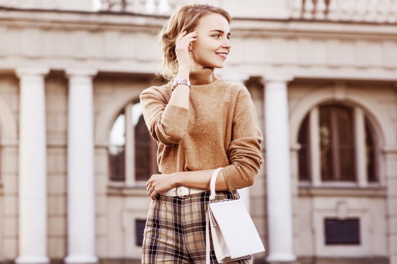 Woman Brown Sweater Pants White Bag