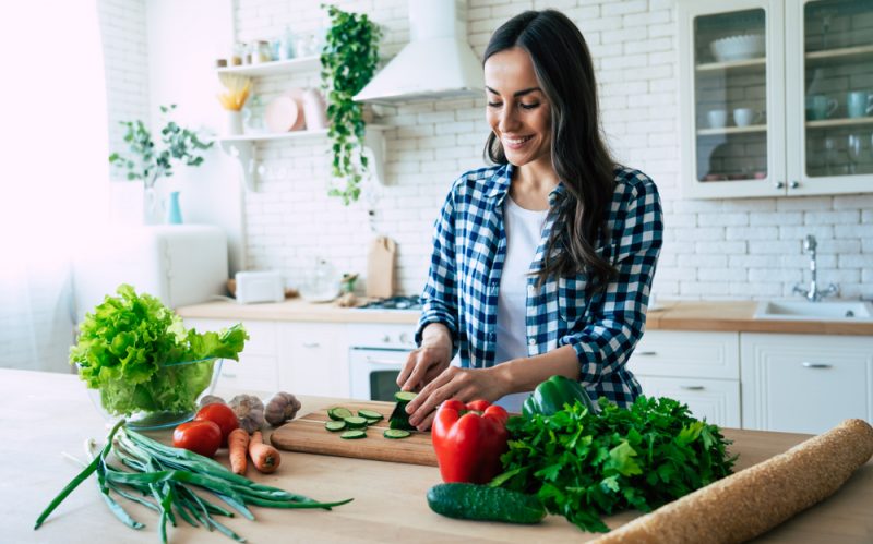 Woman in Kitchen Cooking Healthy