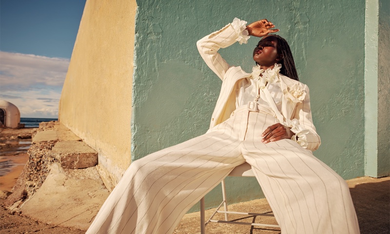 Wearing pinstripes, Adut Akech fronts Zimmermann resort 2021 campaign.