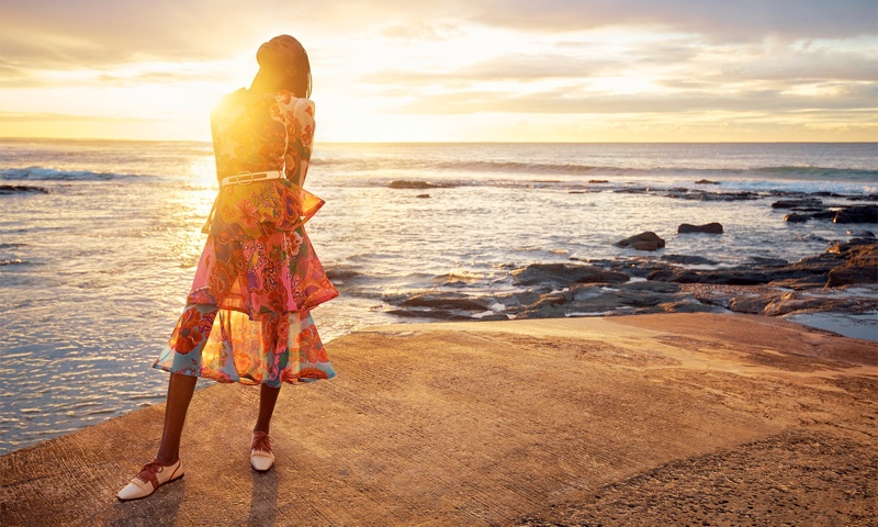 Posing seaside, Adut Akech appears in Zimmermann resort 2021 campaign.