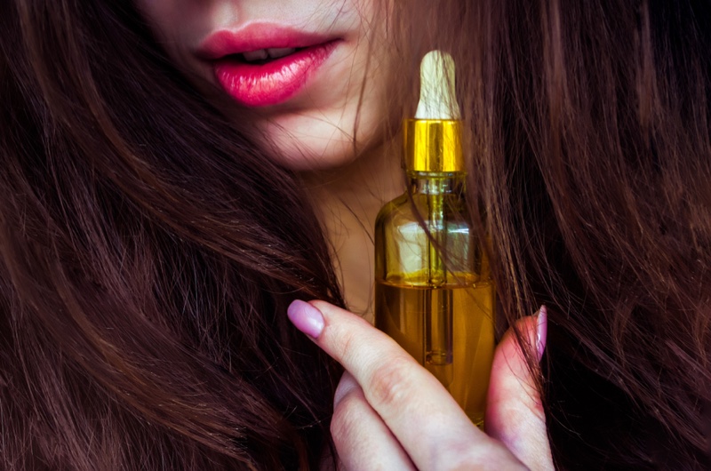 Closeup Model Long Hair Oil Bottle