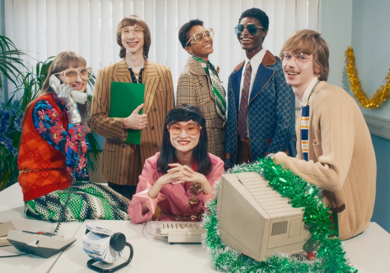 Gucci sets its Holiday 2020 campaign at a festive office party.