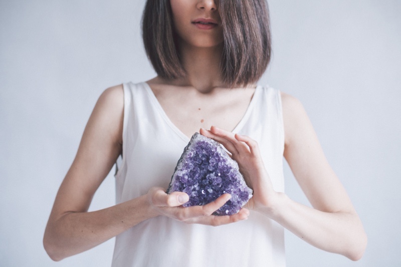 Lady Holding Large Amethyst Crystal Stone