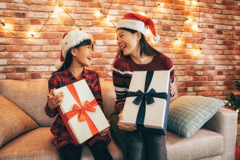 Mom Daughter Asian Holding Christmas Gifts Santa Hats