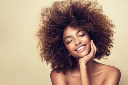 8 Essential Winter Hair Care Tips For Curly Hair Smiling Black Model Curly Hair Beauty