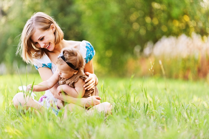 Smiling Mother Blonde Daughter Outdoors Grass Happy