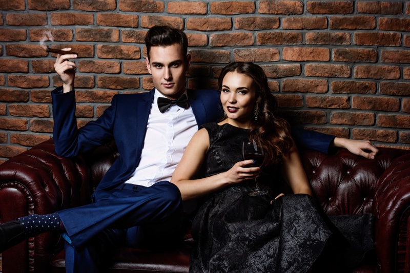 Stylish Couple Man Suit Woman Black Dress Cigar Wine Glass