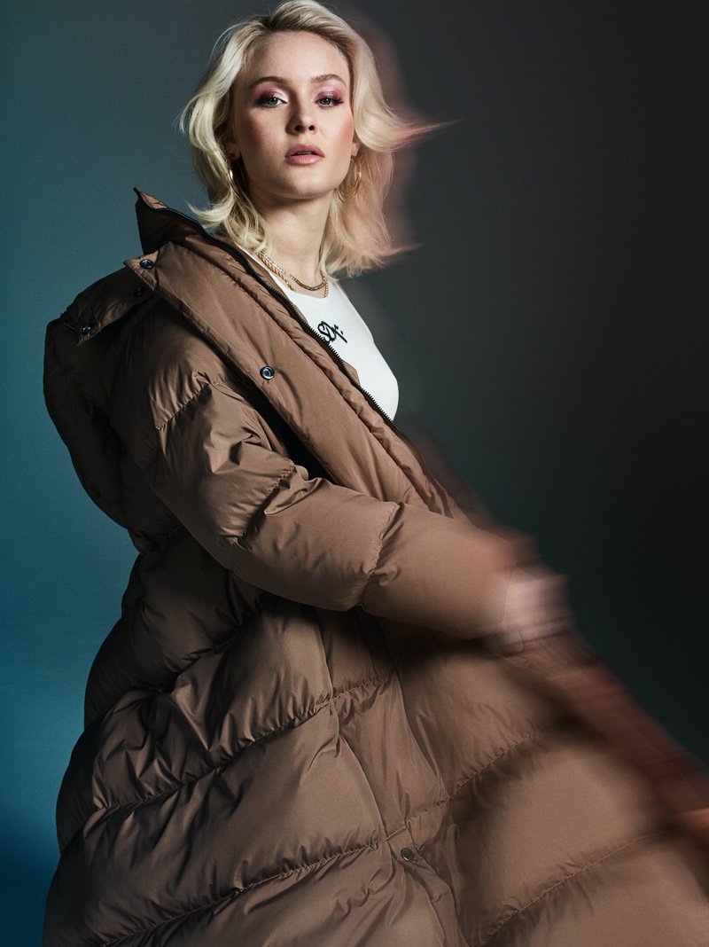 Singer Zara Larsson wears Superdry puffer jacket.
