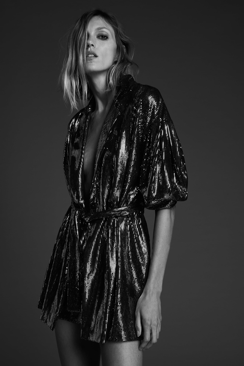 Anja Rubik poses in Zara belted sparkly jumpsuit.