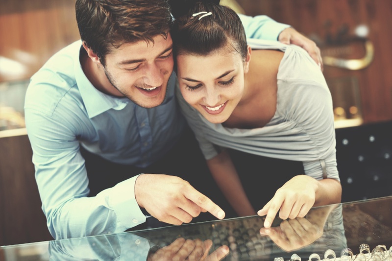 Couple Choosing Rings Jewelry Store