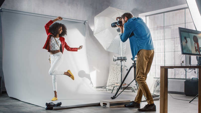 Fashion Photographer Capturing Black Model Camera Behind Scenes