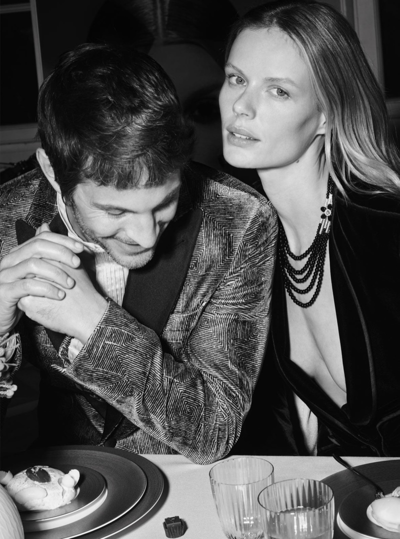 Kelly Rippy and Marlijn Hoek pose at a dinner setting for Giorgio Armani Holiday 2020 campaign.