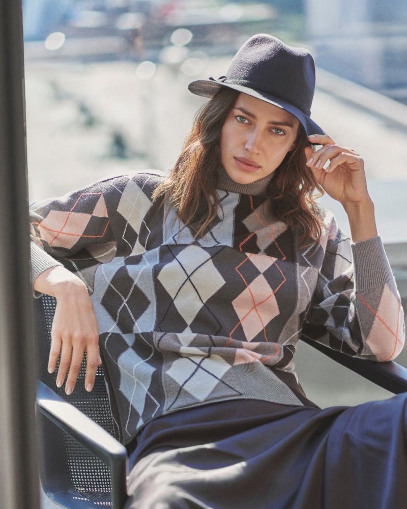 Irina Shayk wears an argyle sweater from Falconeri.