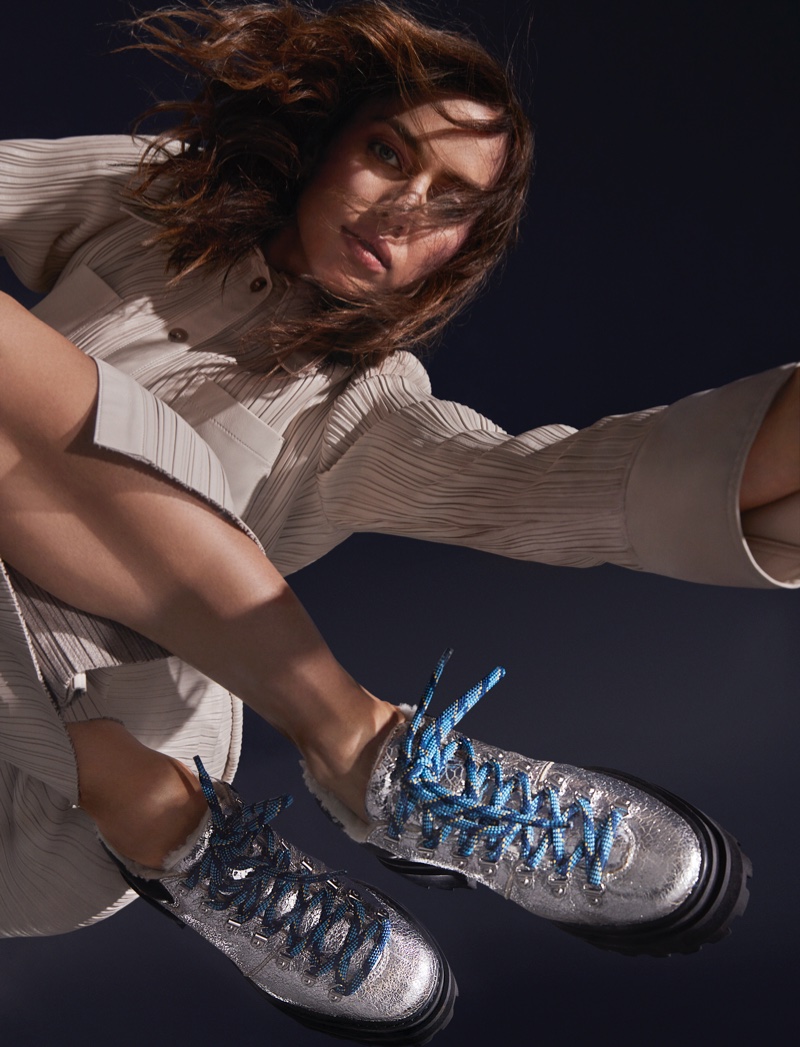 Irina Shayk models Schutz Lucille shearling bootie for the shoe brand's Holiday 2020 campaign.