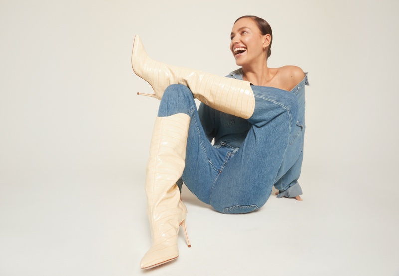 Flashing a smile, Irina Shayk wears Schutz Maryana boot in eggshell.