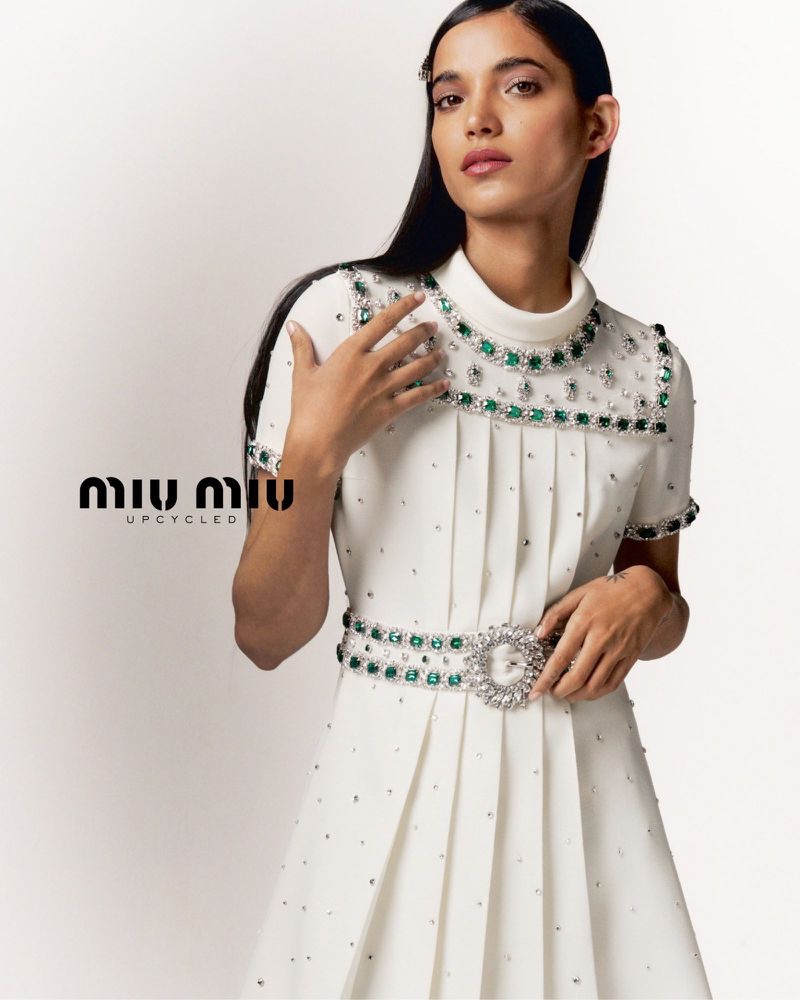 Amrit poses in Miu Miu Upcycled collection.
