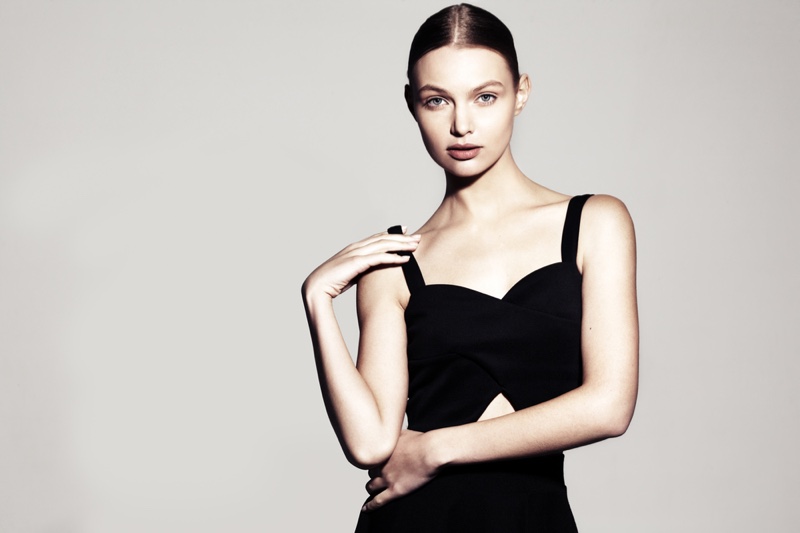 Model Form-Fitting Black Dress Neutral Background