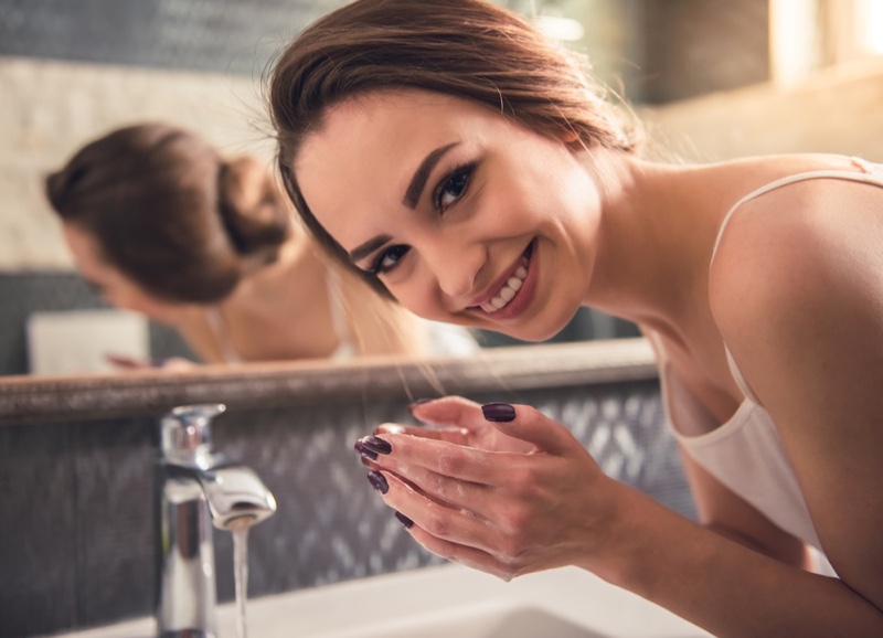 Smiling Woman Washing Hands