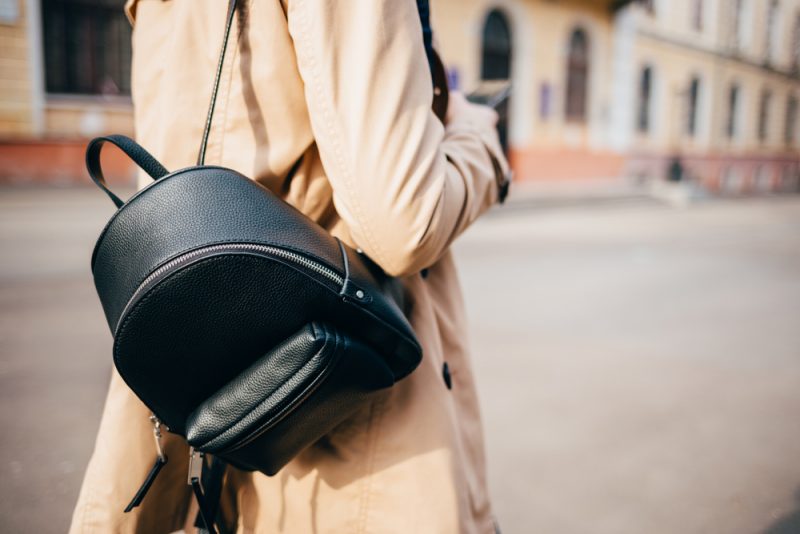 Woman with Leather Backpack