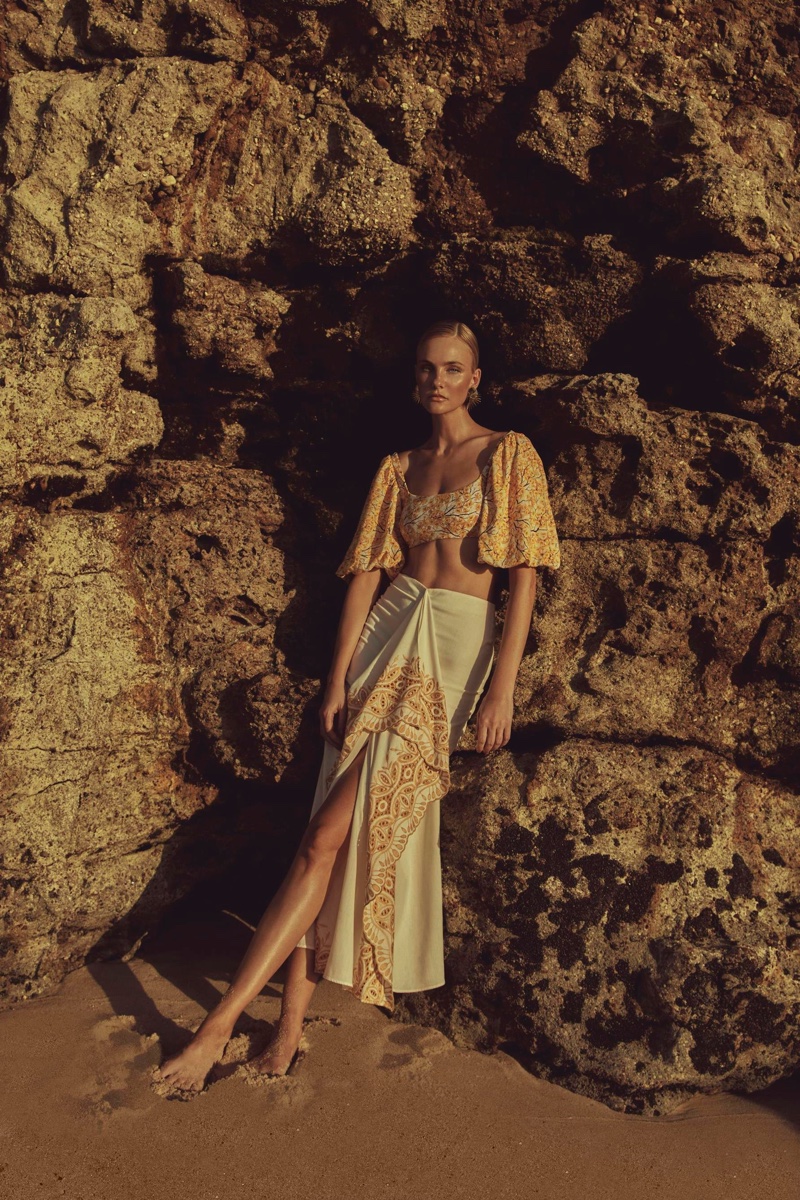 Posing at the beach, Caroline Trentini models Agua de Coco Cerrado collection.