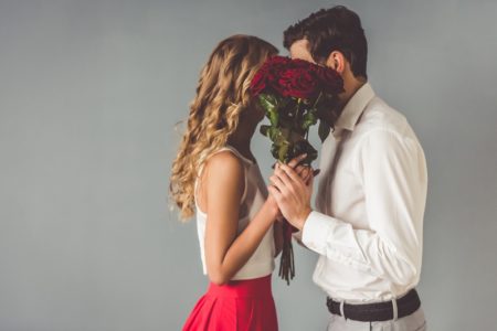 The 7 Best Online Marriage Counseling Programs Couple Behind Flowers Romantic Concept