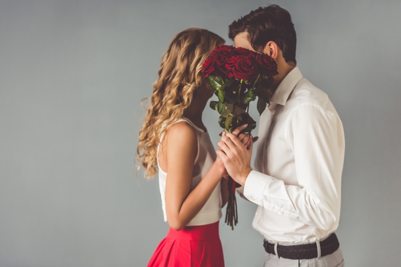 Couple Behind Flowers Romantic Concept