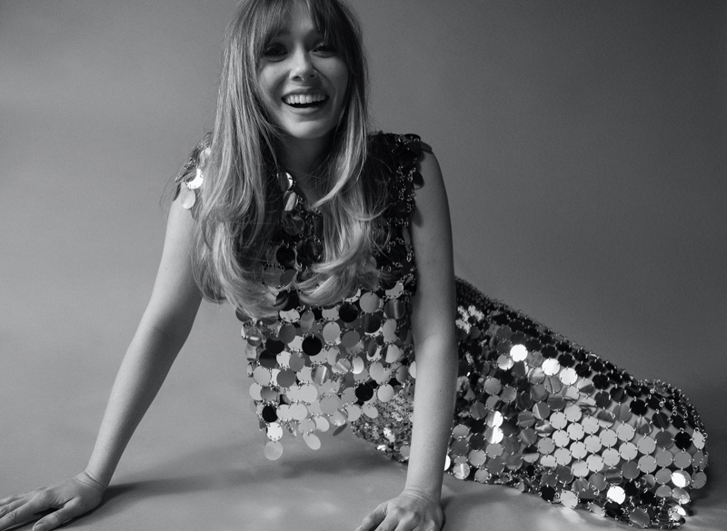 Shining in paillettes, Elizabeth Olsen wears Paco Rabanne silver top and skirt. Photo: Amar Daved