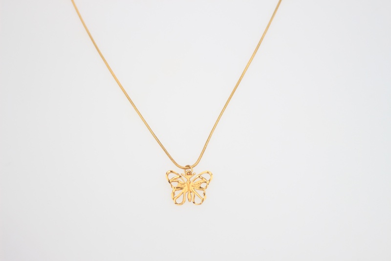 Gold Pendant Butterfly Necklace Grey Background