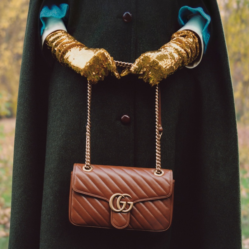 Celeste poses with Gucci GG Marmont bag.