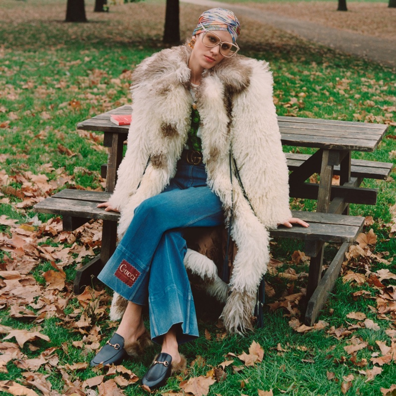 Alexa Chung poses in Gucci faux fur coat for the brand's Winter in the Park campaign.