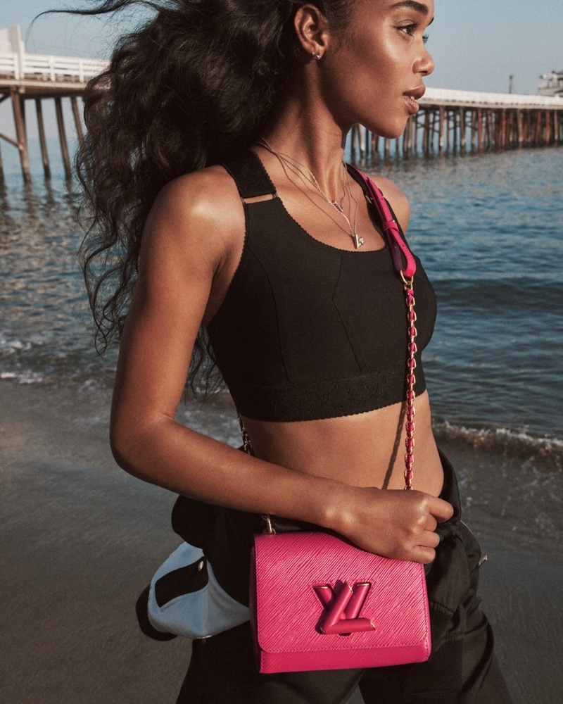 Laura Harrier wears Louis Vuitton Twist PM bag in freesia pink.