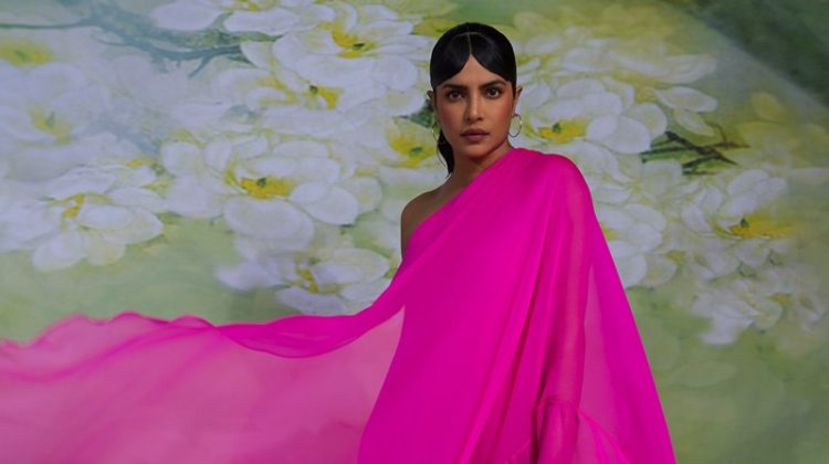 Draped in hot pink, Priyanka Chopra wears Valentino dress, Cartier jewelry, and Jimmy Choo heels.