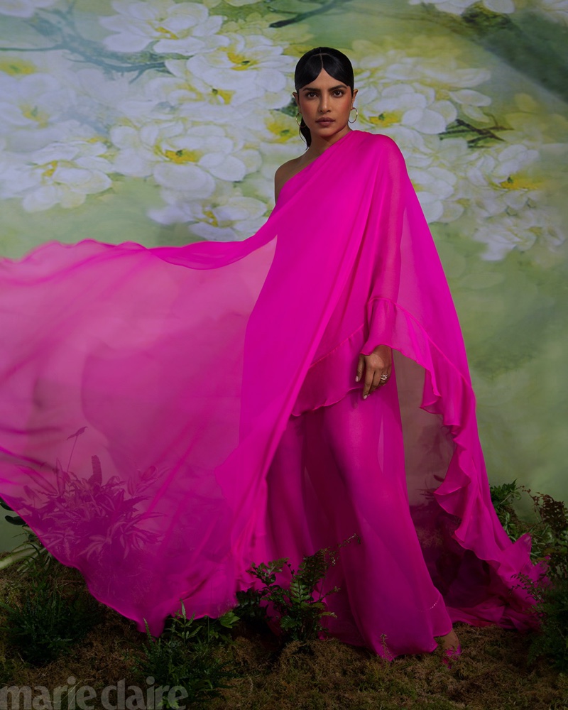 Draped in hot pink, Priyanka Chopra wears Valentino dress, Cartier jewelry, and Jimmy Choo heels.